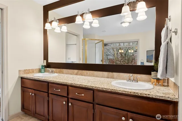 a view of walk in closet with clothes