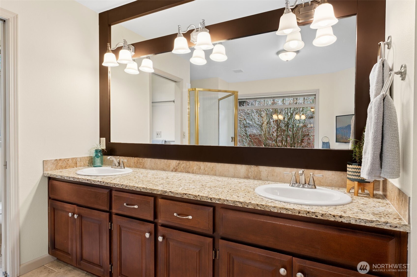 19301 4th Place Southwest Normandy Park, WA 98166 - Photo 22 of 37 a bathroom with a granite countertop double vanity sink and a mirror