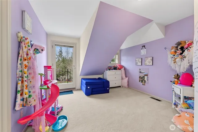 a bathroom with a sink double vanity granite tub and a mirror