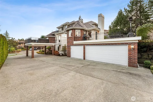 a balcony with wooden floor table and chairs