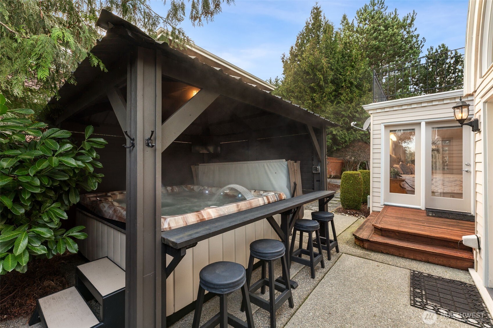 19301 4th Place Southwest Normandy Park, WA 98166 - Photo 31 of 40 a balcony with wooden floor table and chairs