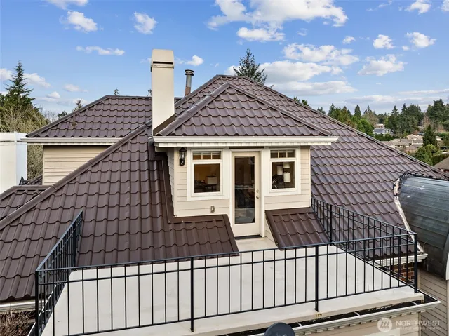 a view of a house with wooden fence
