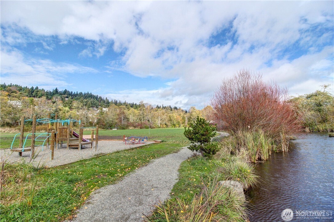 19301 4th Place Southwest Normandy Park, WA 98166 - Photo 36 of 37 a view of a garden with mountains in the background