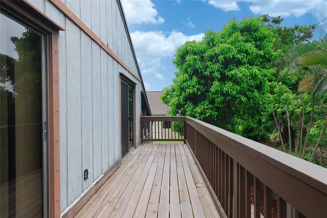 a view of balcony and yard