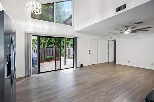 a kitchen with kitchen island a sink stove and microwave