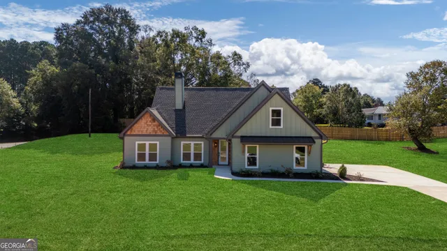a front view of a house with garden