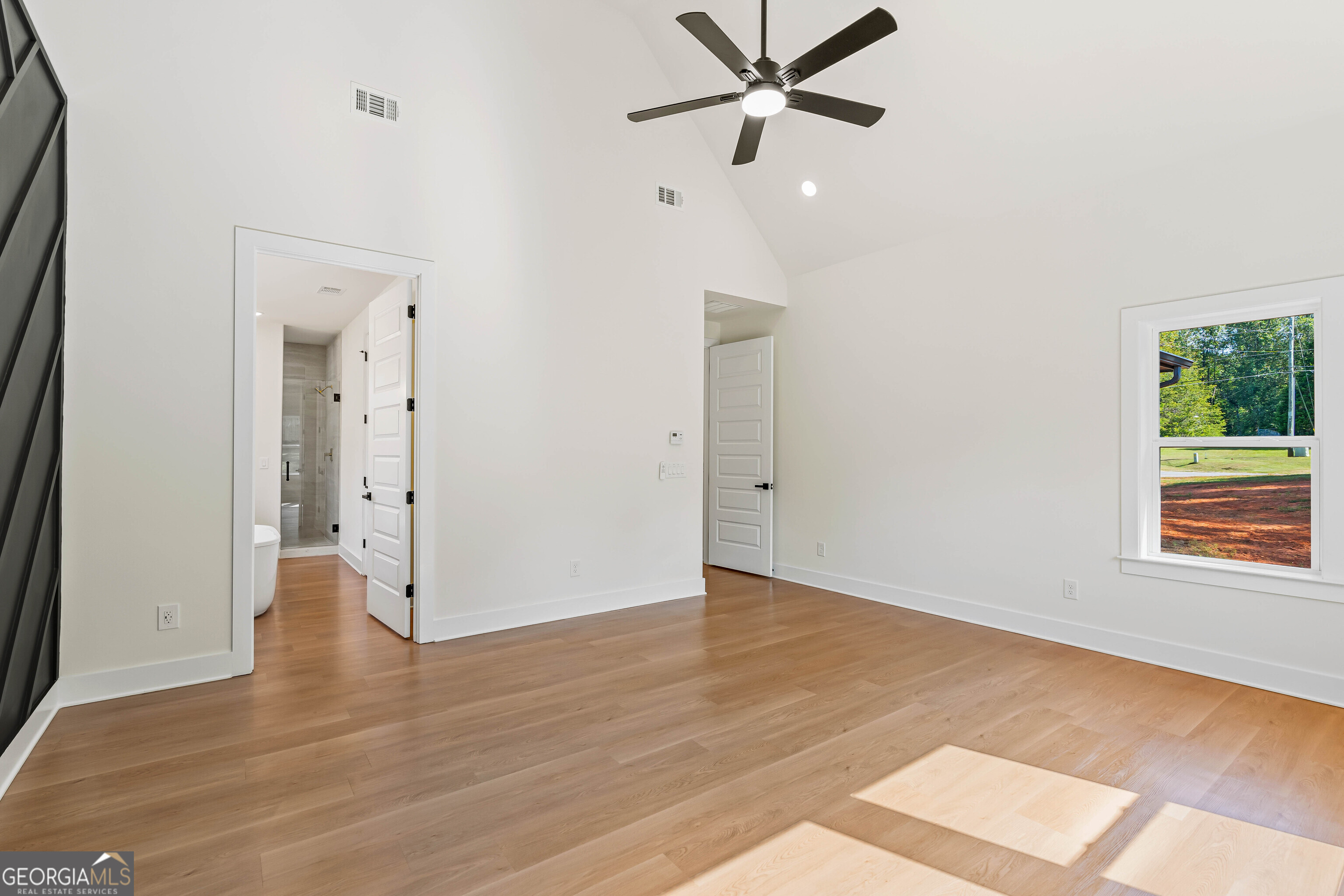 117 Oak Terrace Drive Clarkesville, GA 30523 - Photo 22 of 50 an empty room with wooden floor closet and windows