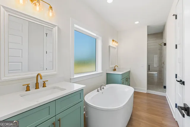 a bathroom with a granite countertop toilet and a shower