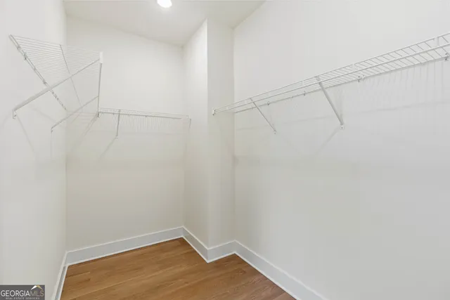 a white bath tub sitting next to a bathroom sink