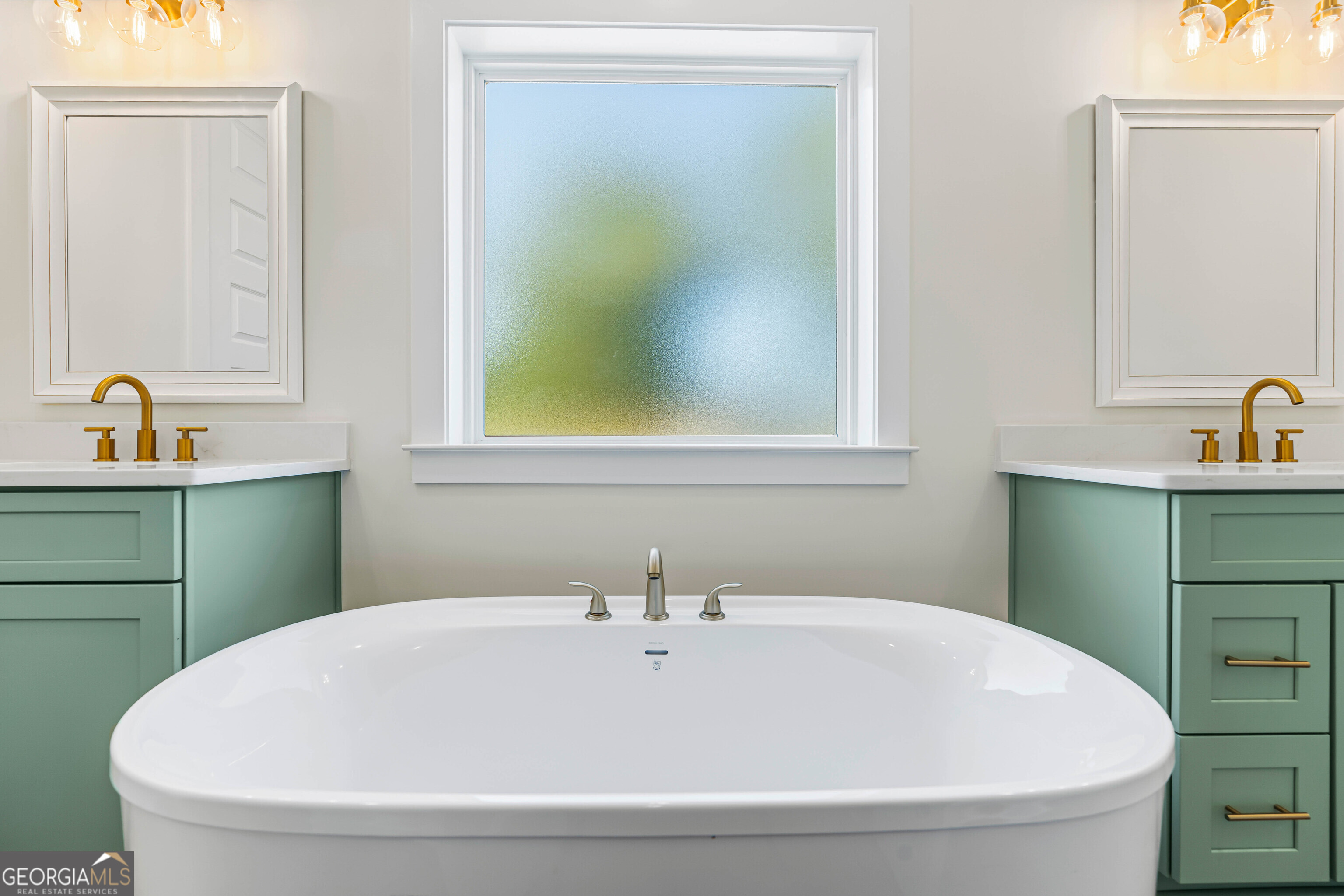 117 Oak Terrace Drive Clarkesville, GA 30523 - Photo 28 of 50 a white bath tub sitting next to a bathroom sink