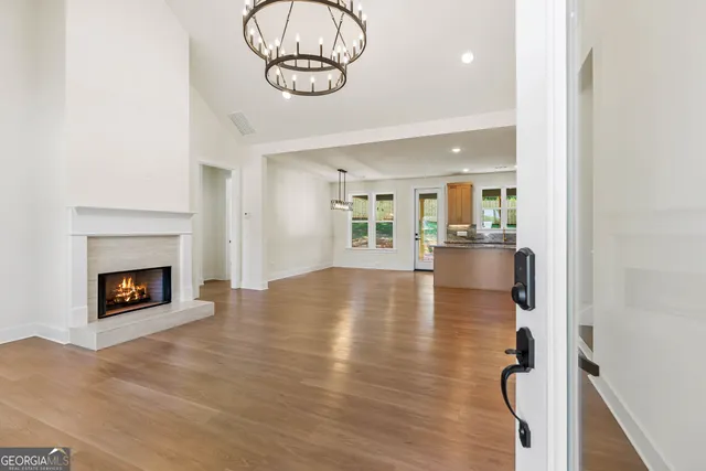 a view of an empty room and fire place