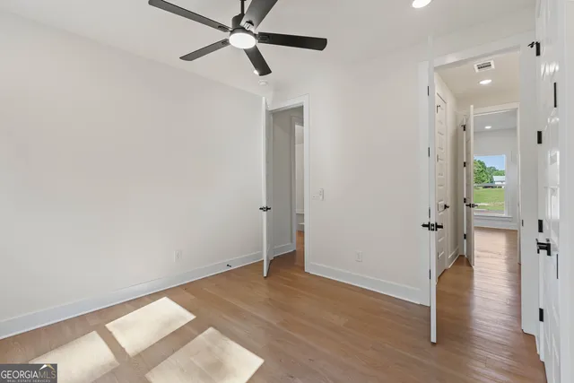 a bathroom with a double vanity sink a mirror and a shower