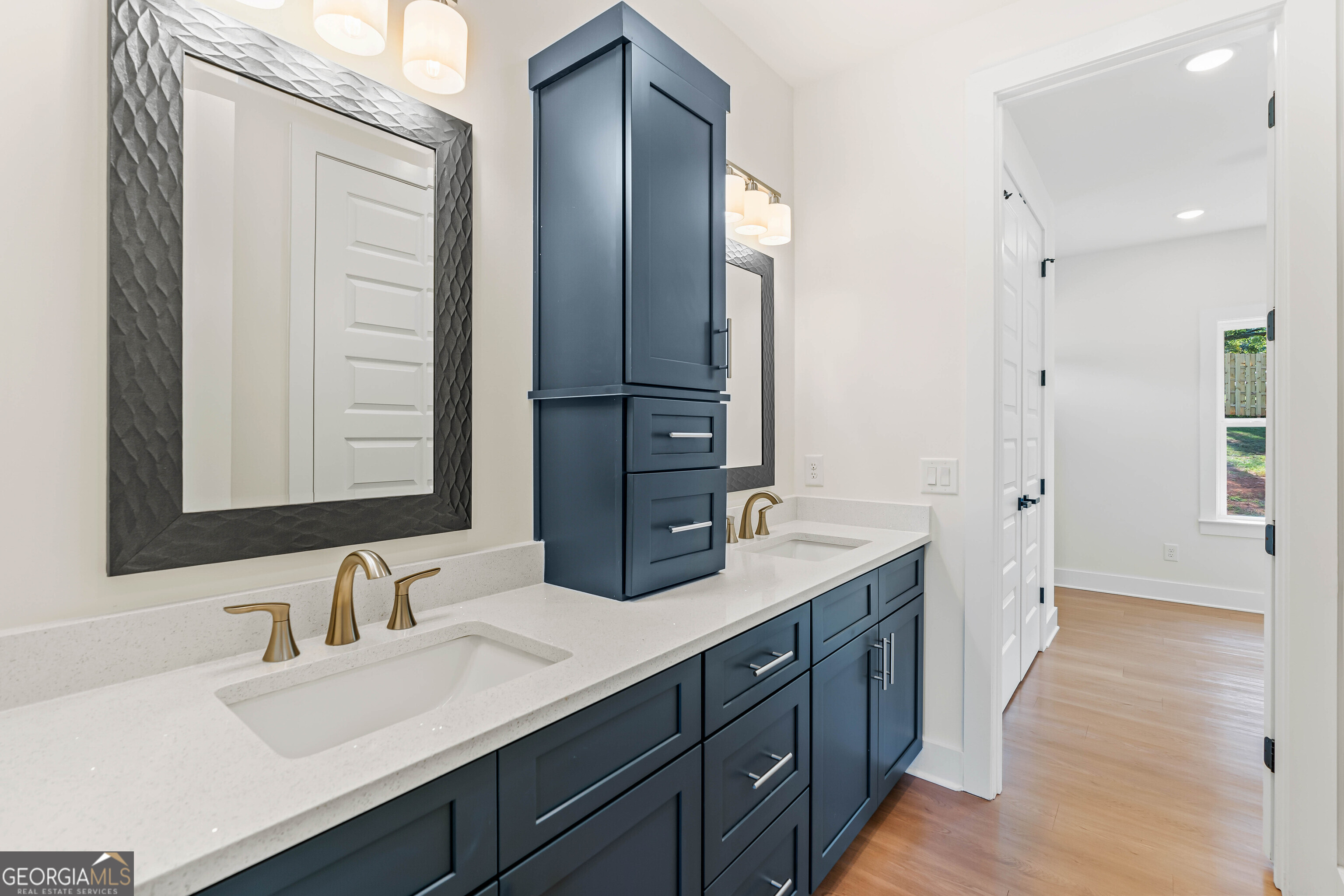 117 Oak Terrace Drive Clarkesville, GA 30523 - Photo 34 of 50 a bathroom with a double vanity sink and mirror