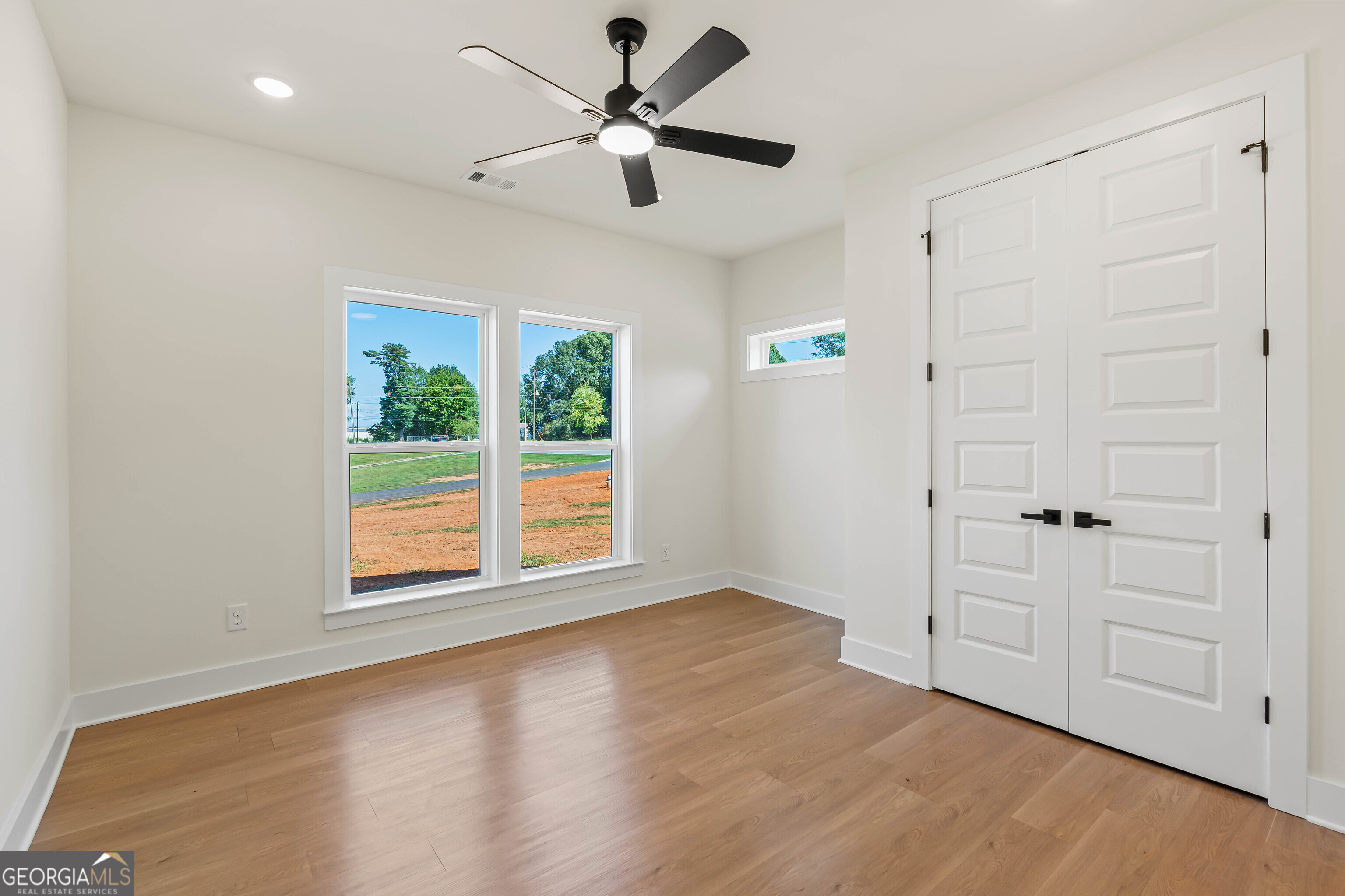 117 Oak Terrace Drive Clarkesville, GA 30523 - Photo 38 of 50 wooden floor in an empty room with a window