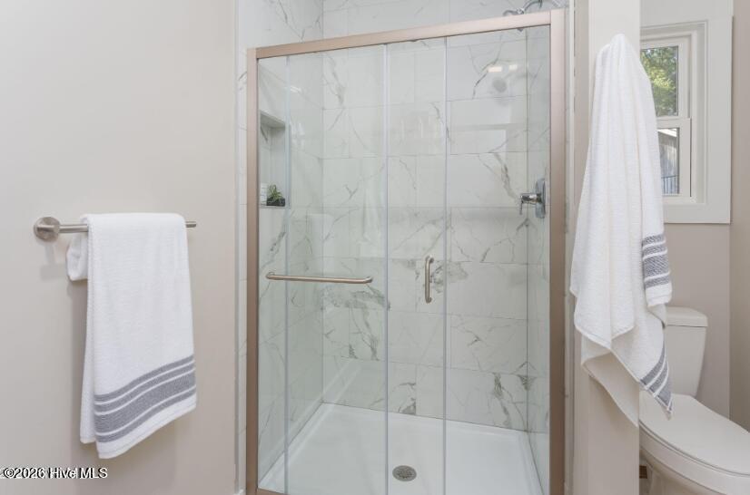 133 Spring Road Wilmington, NC 28401 - Photo 12 of 29 Spacious master bathroom with double vanities and tiled walk-in shower.