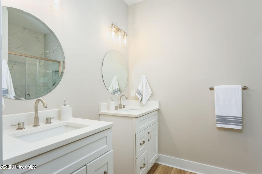 133 Spring Road Wilmington, NC 28401 - Photo 13 of 29 Spacious master bathroom with double vanities and tiled walk-in shower.