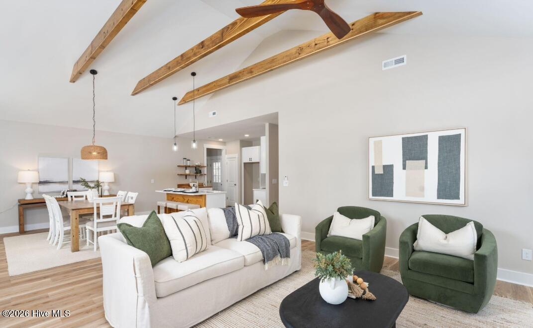 133 Spring Road Wilmington, NC 28401 - Photo 3 of 29 Spacious Living Room with high ceilings and beautiful beams across the ceiling