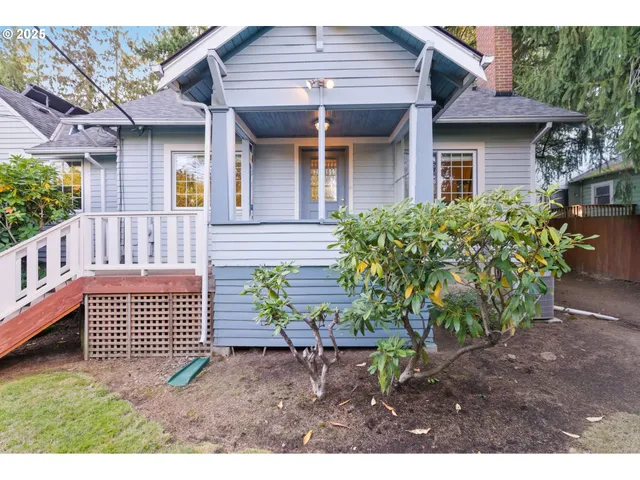 a front view of a house with a garden