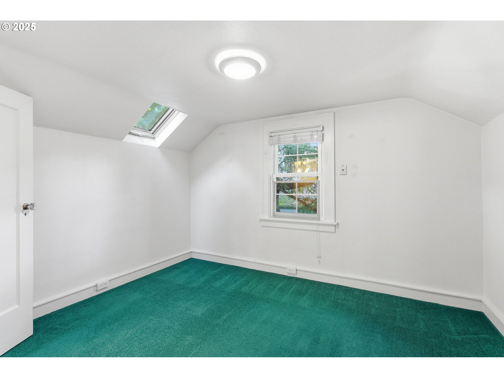 8015 Southwest 45th Avenue Portland, OR 97219 - Photo 24 of 38 a view of an empty room with a window
