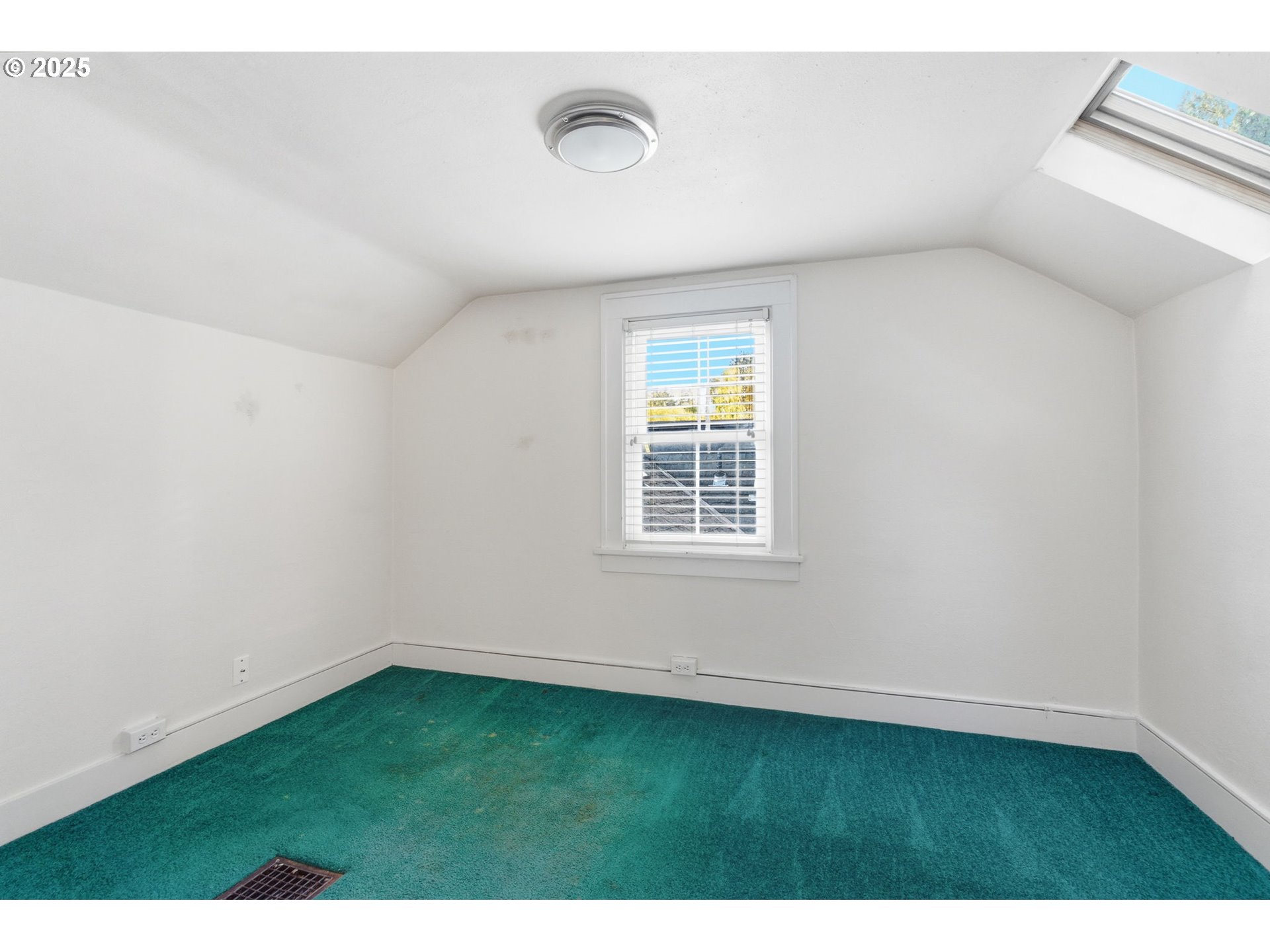 8015 Southwest 45th Avenue Portland, OR 97219 - Photo 25 of 38 a view of an empty room with a window