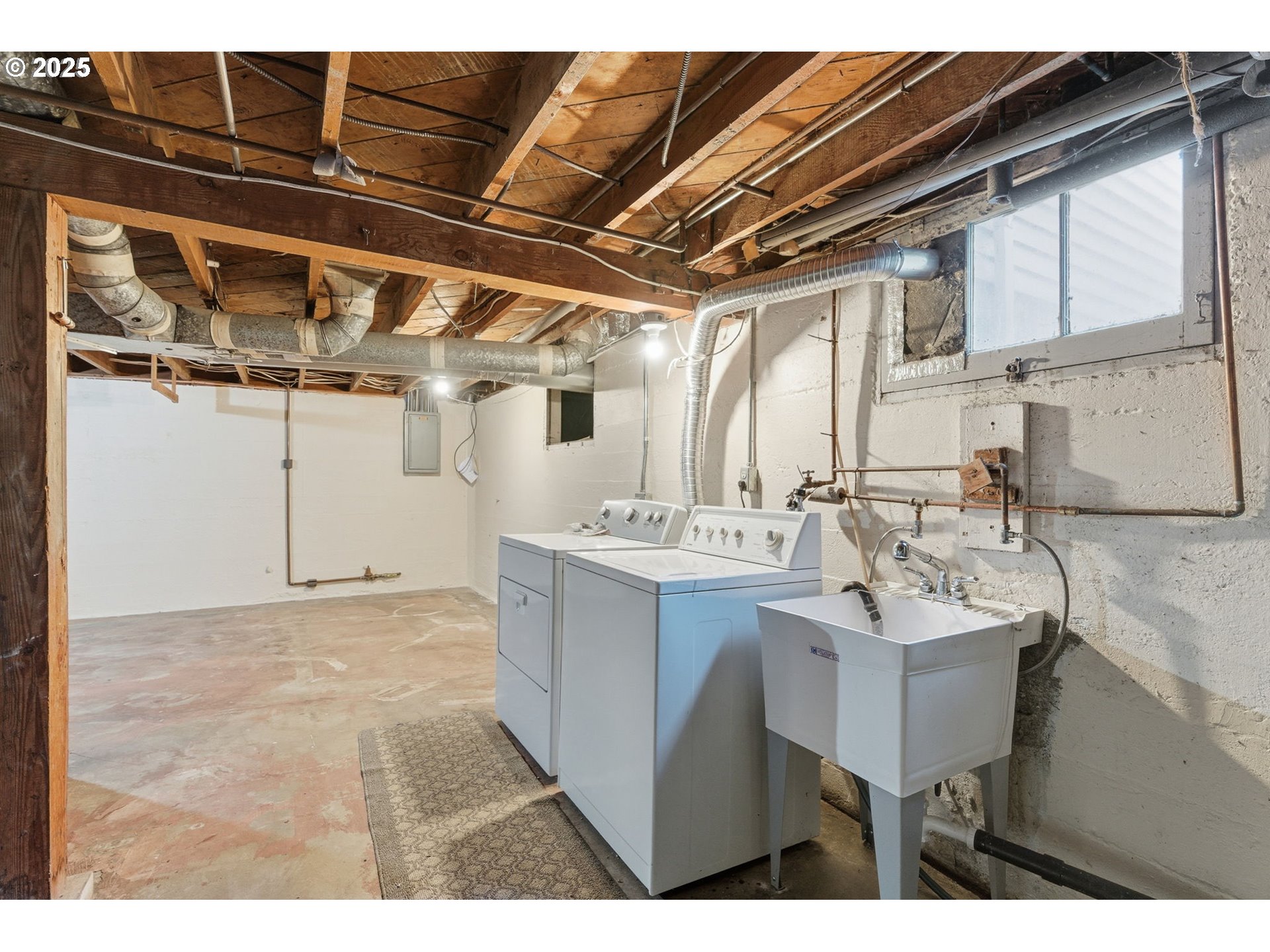 8015 Southwest 45th Avenue Portland, OR 97219 - Photo 28 of 38 a kitchen with a sink and cabinets