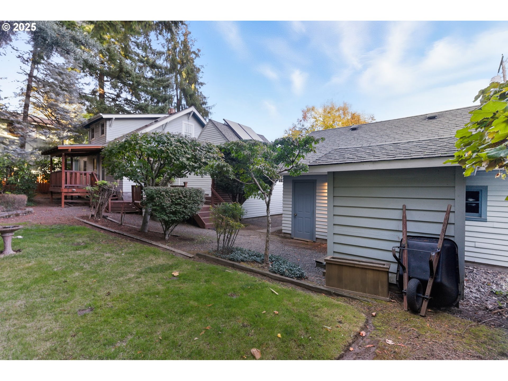 8015 Southwest 45th Avenue Portland, OR 97219 - Photo 37 of 38 a backyard of a house with table and chairs