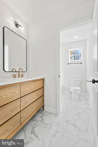 a view of an entryway with wooden floor and windows