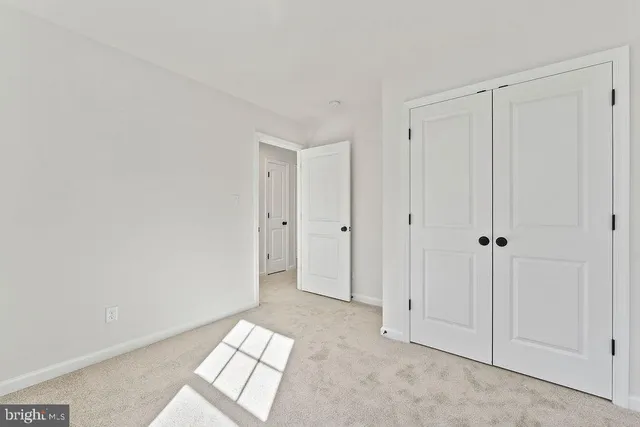 a view of a hallway with windows