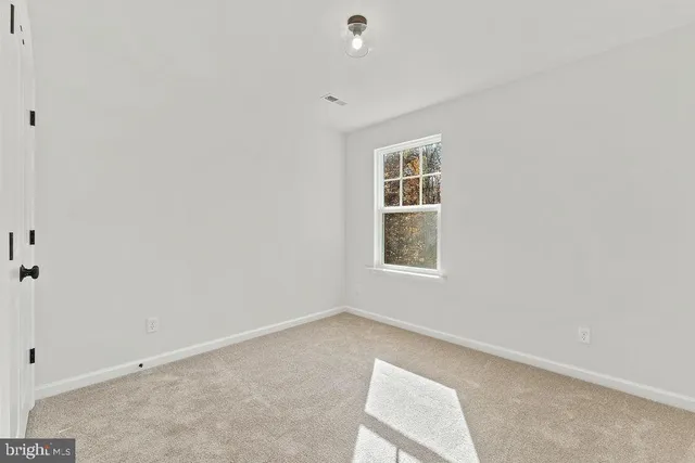 a view of a hallway with windows