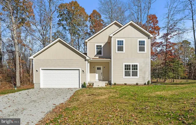 a view of a backyard with large trees