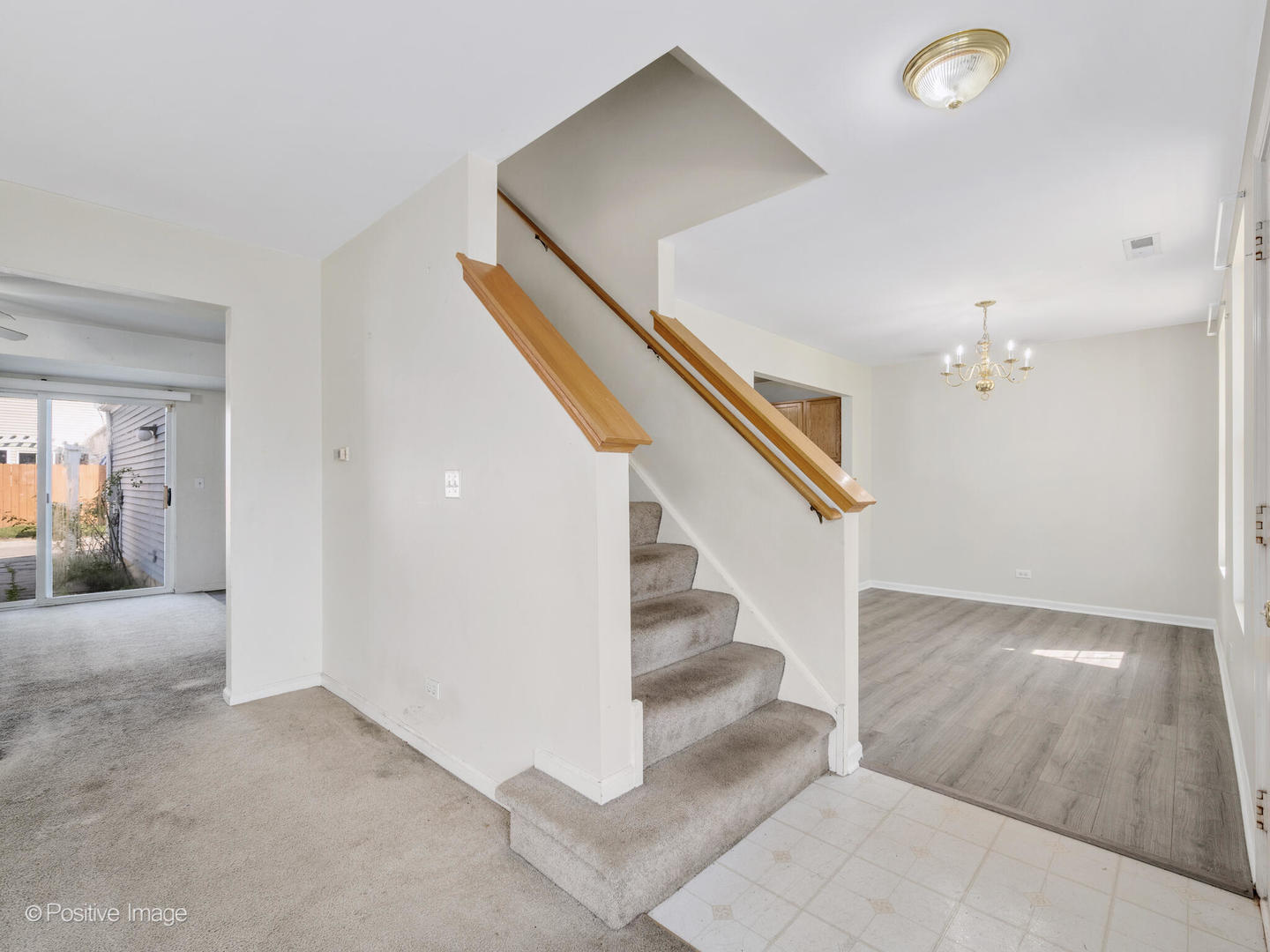 948 Symphony Drive Aurora, IL 60504 - Photo 8 of 22 a view of a hallway view with staircase