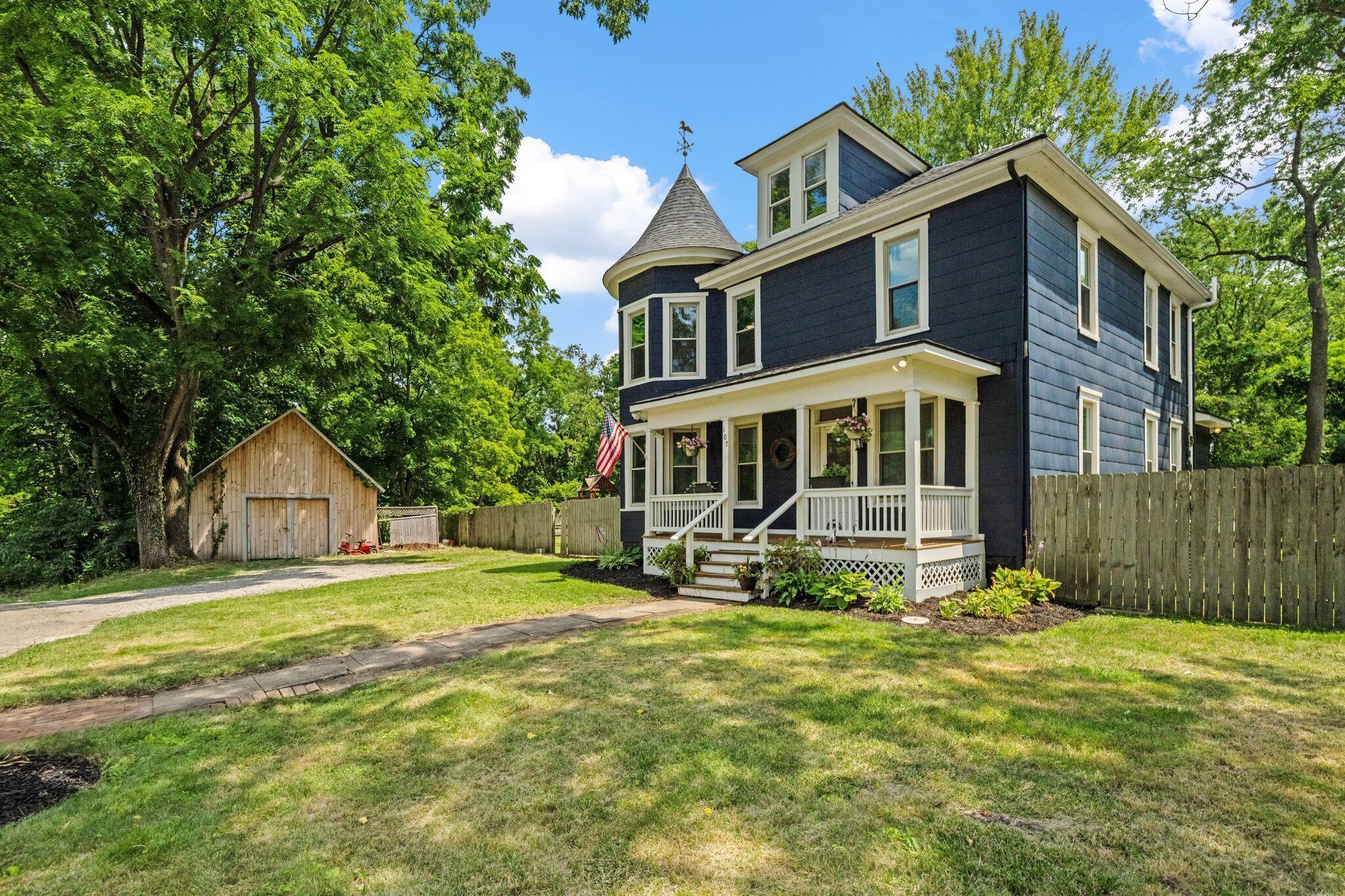 107 Price Road Columbus, OH 43230 - Photo 1 of 51 Dark blue exterior with white trim and a prominent turret