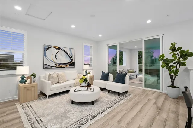 a living room with furniture and a potted plant