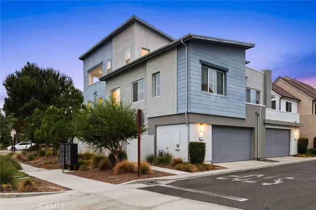 a front view of a house with yard