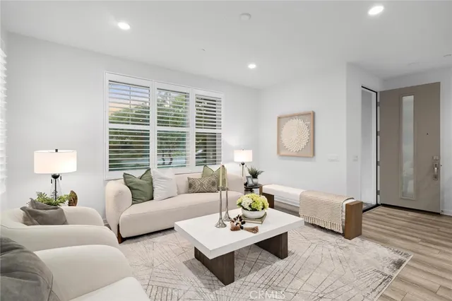 a living room with furniture and a large window