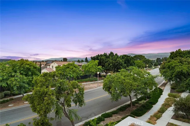 a view of a city with sunset background