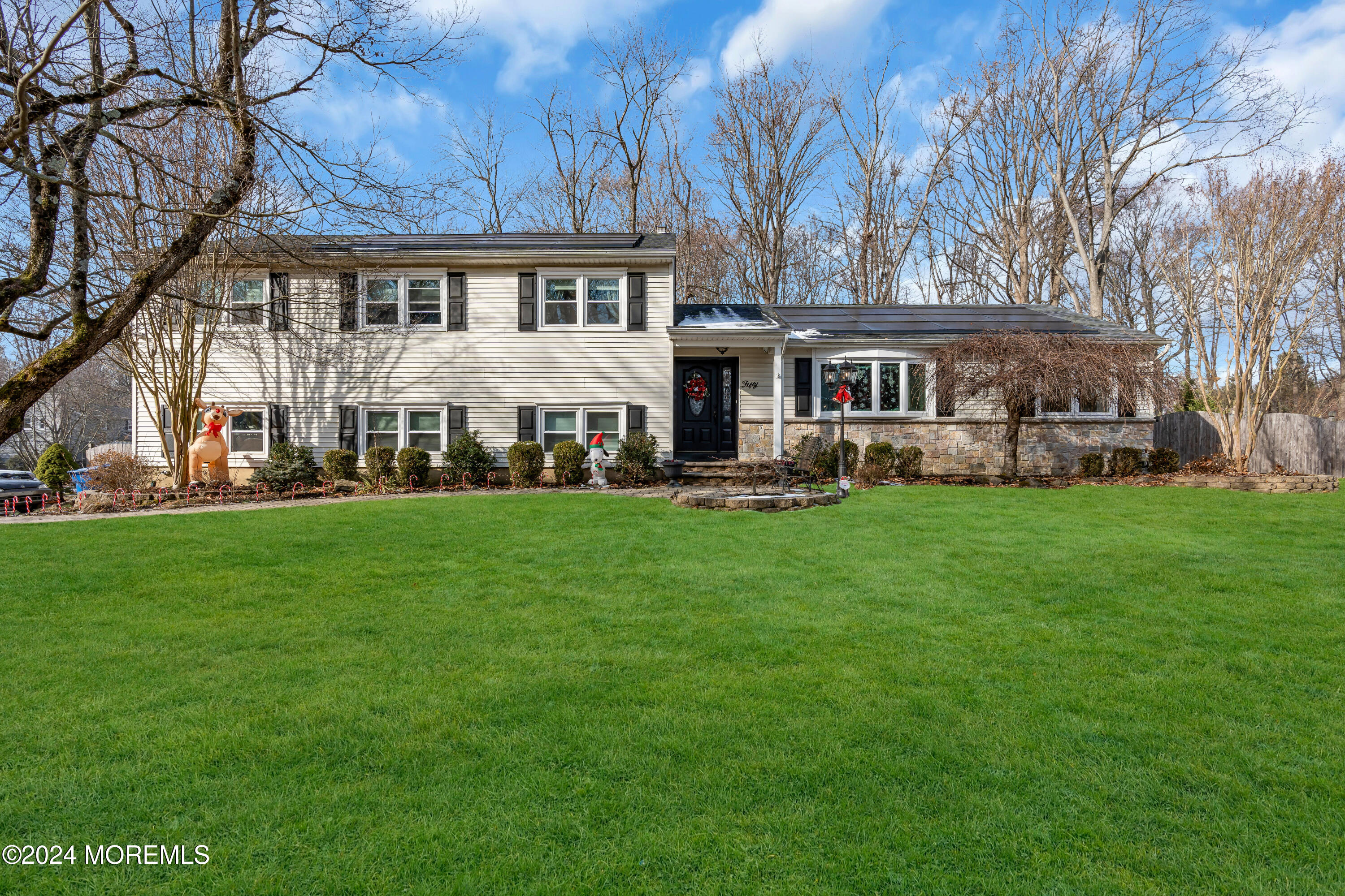 50 Hawthorne Road Middletown, NJ 07701 - Photo 2 of 33 a view of a house with a big yard and large trees