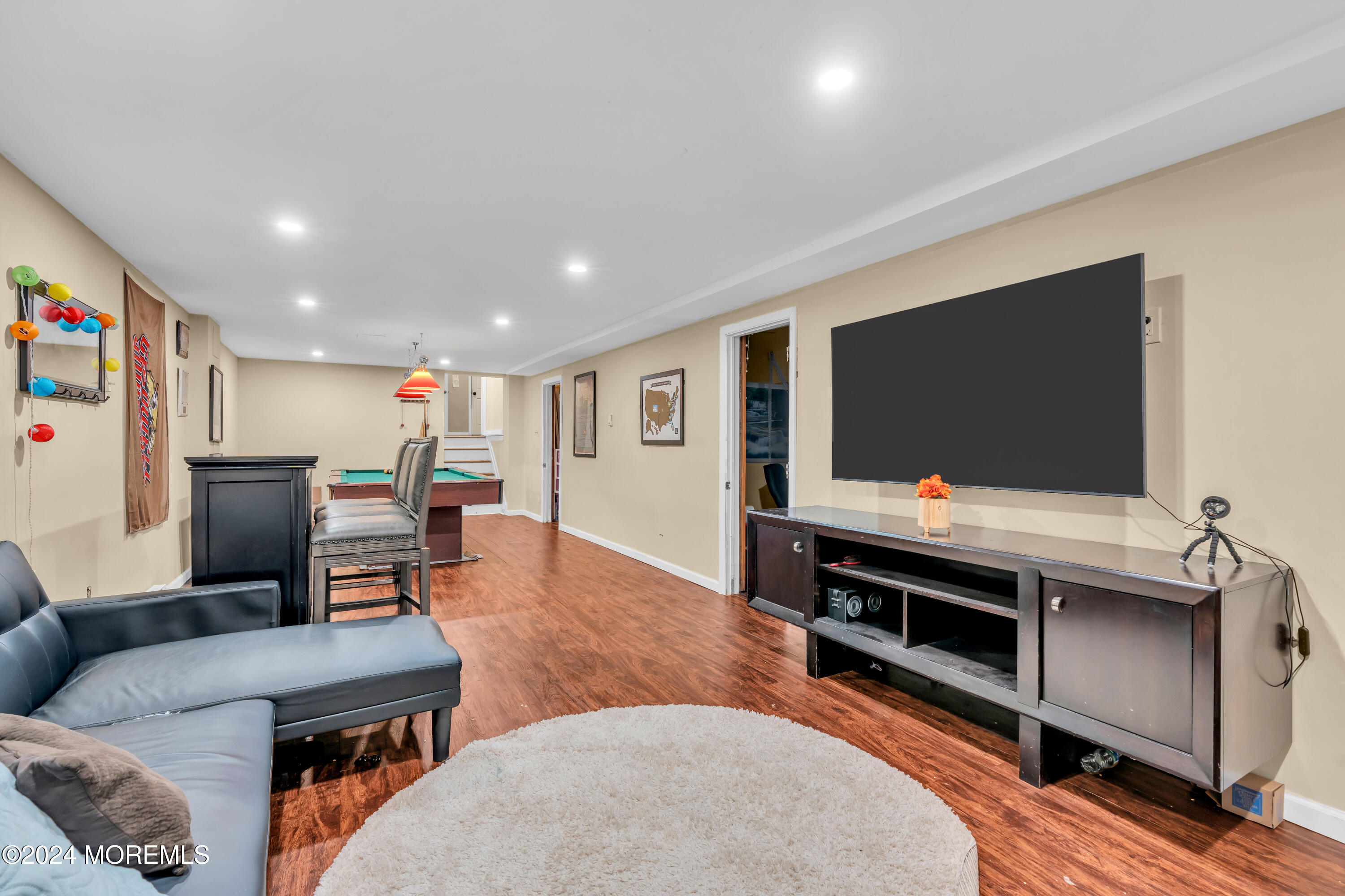 50 Hawthorne Road Middletown, NJ 07701 - Photo 27 of 33 a living room with furniture and a flat screen tv