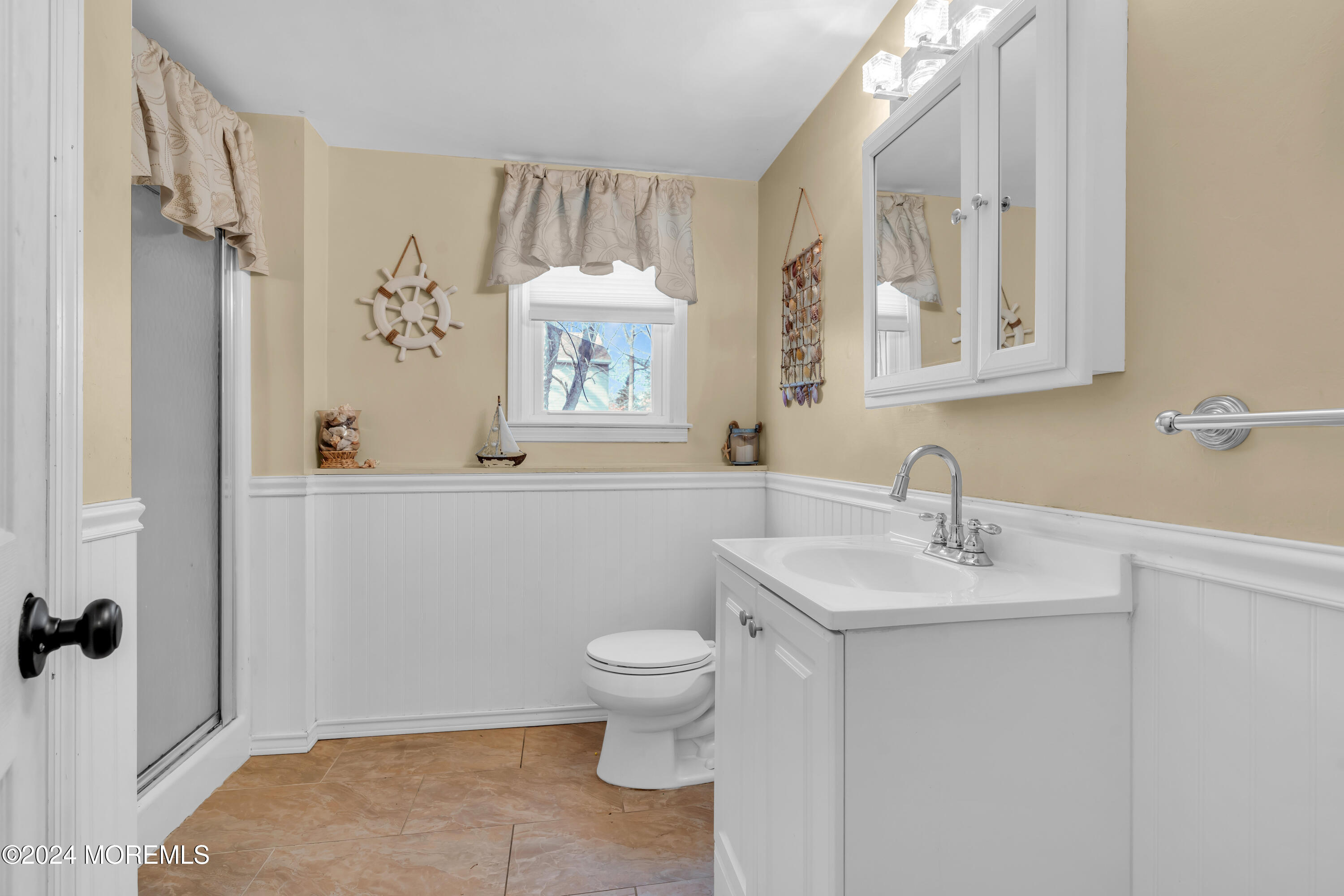 50 Hawthorne Road Middletown, NJ 07701 - Photo 28 of 33 a bathroom with a sink toilet and a mirror