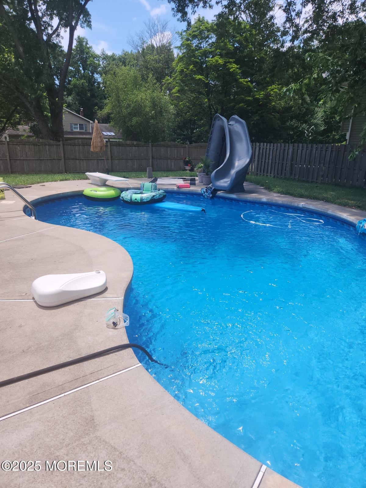50 Hawthorne Road Middletown, NJ 07701 - Photo 30 of 33 a swimming pool with wooden fence