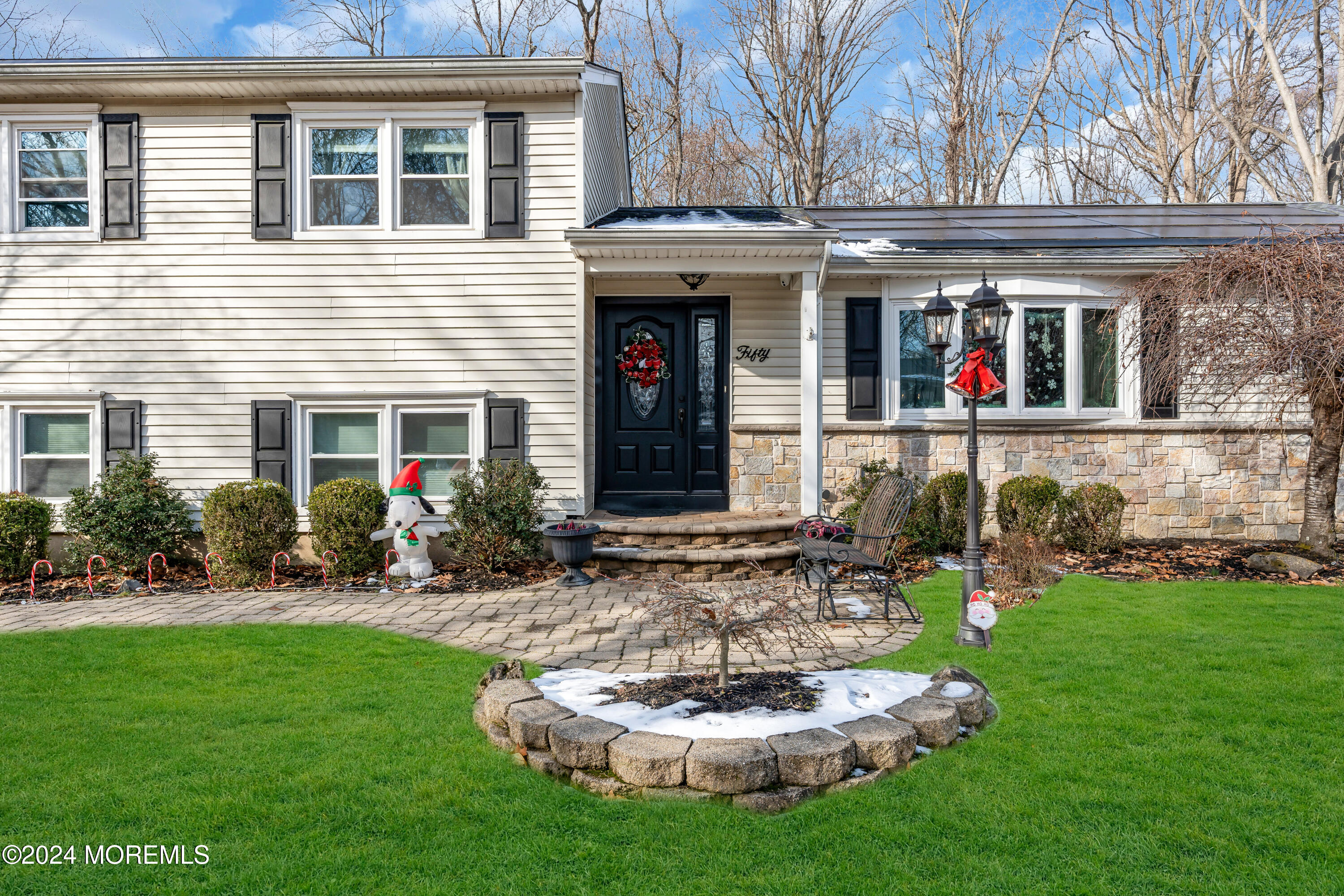 50 Hawthorne Road Middletown, NJ 07701 - Photo 3 of 33 a front view of a house with a yard