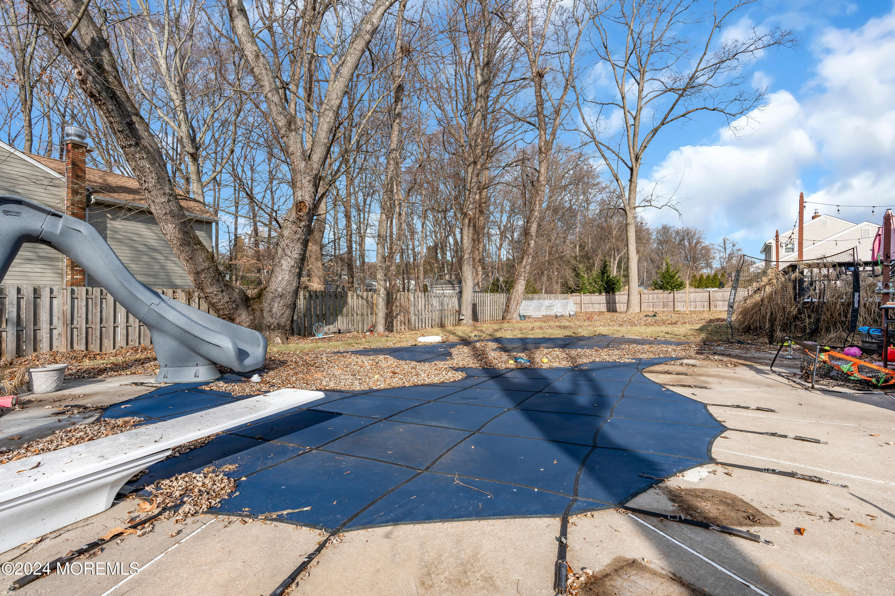 50 Hawthorne Road Middletown, NJ 07701 - Photo 31 of 33 a view of a yard with wooden fence