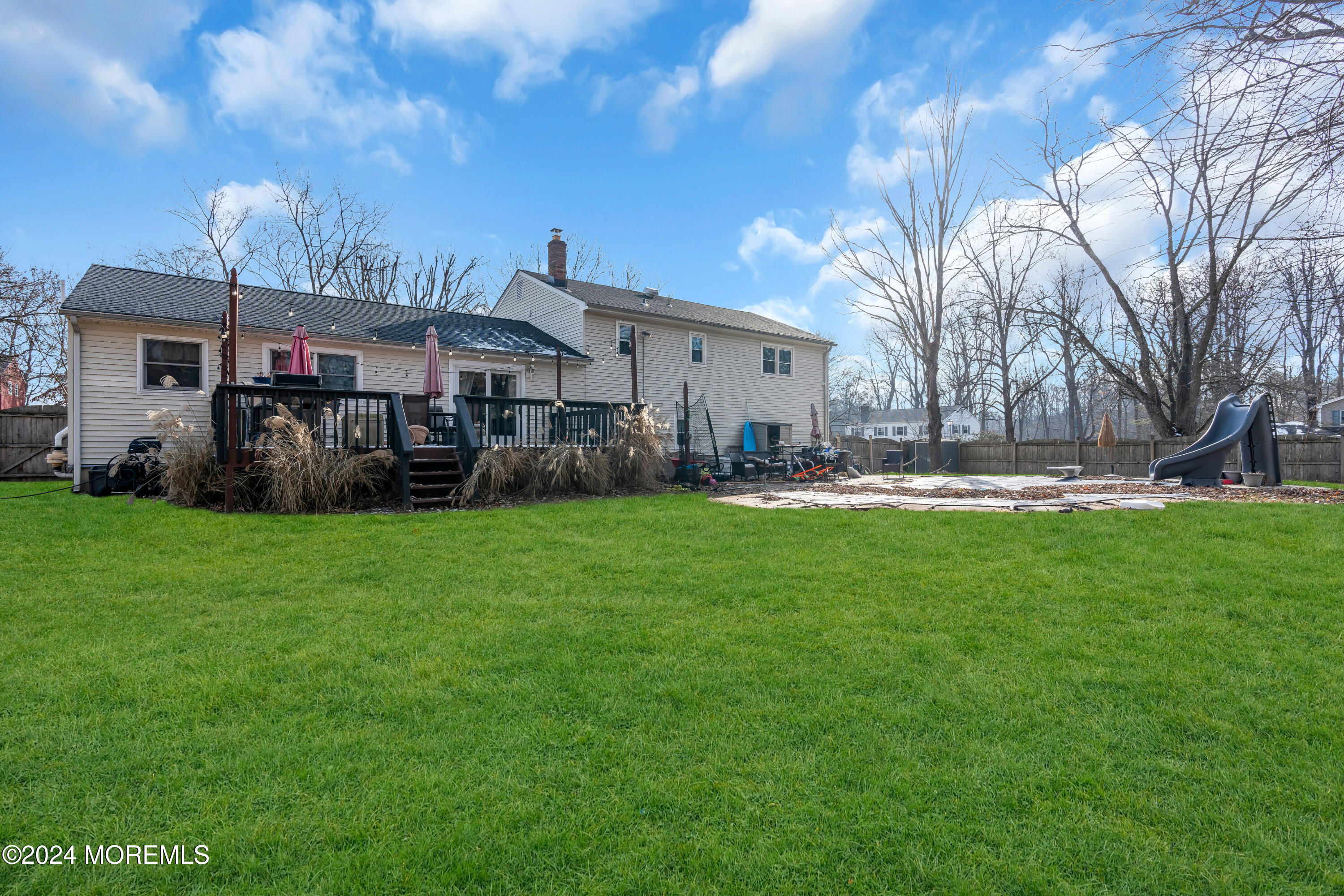 50 Hawthorne Road Middletown, NJ 07701 - Photo 33 of 33 a front view of a house with a garden and plants