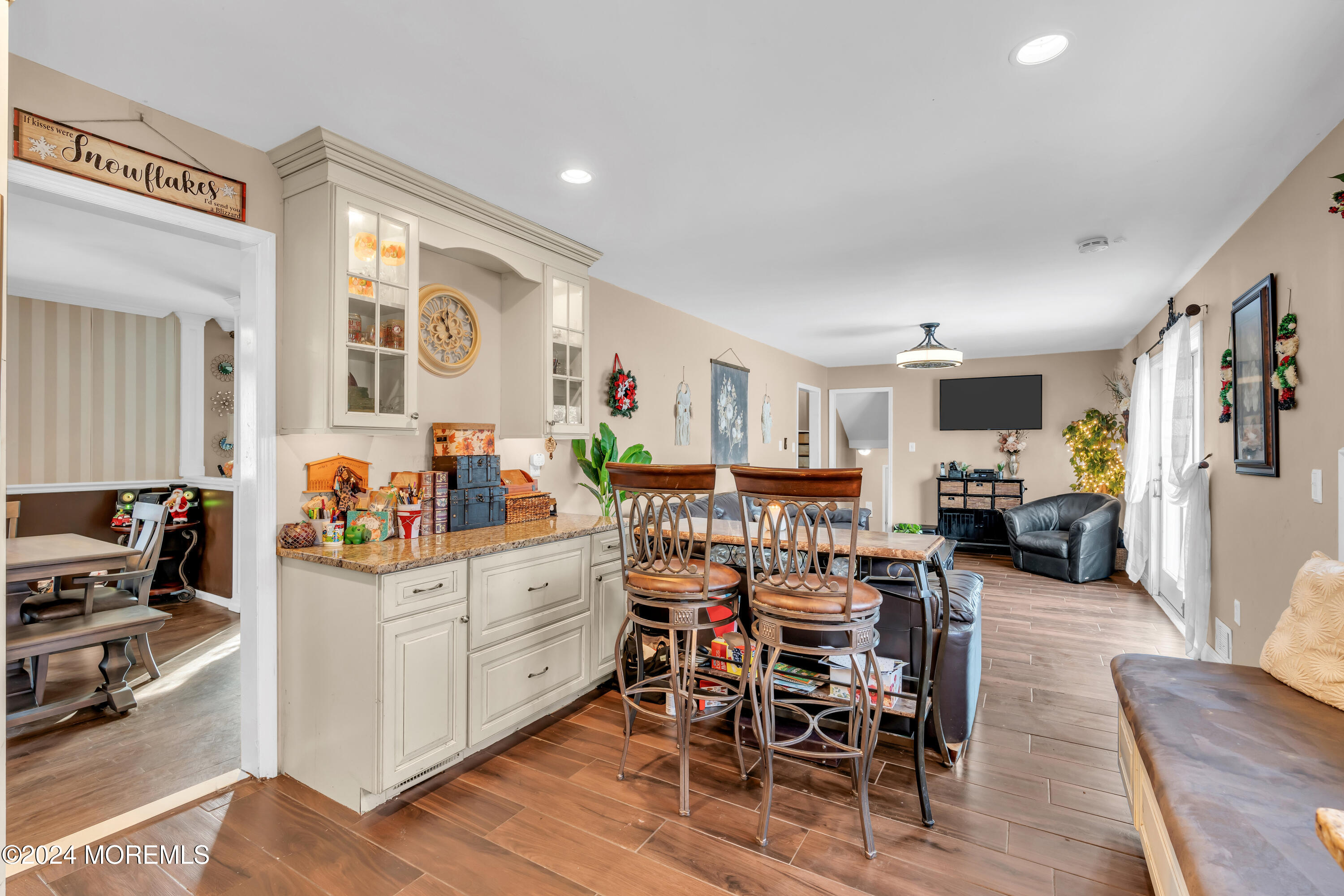 50 Hawthorne Road Middletown, NJ 07701 - Photo 10 of 33 a kitchen with stainless steel appliances kitchen island granite countertop a table and chairs in it