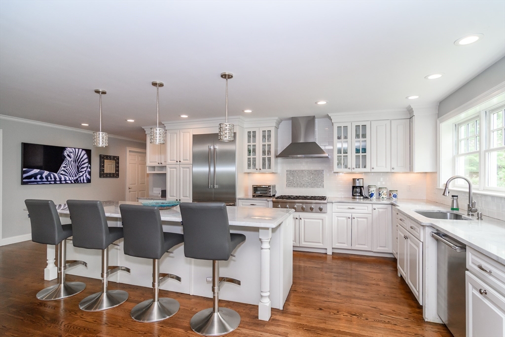 1098 Webster Street Needham, MA 02492 - Photo 2 of 21 a kitchen with stainless steel appliances kitchen island granite countertop a sink and cabinets