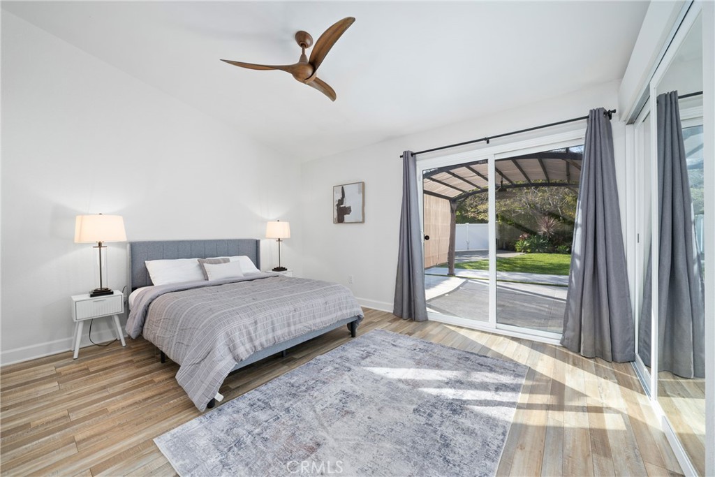 2973 Bonanza San Clemente, CA 92673 - Photo 17 of 41 a bedroom with a large bed and a large window