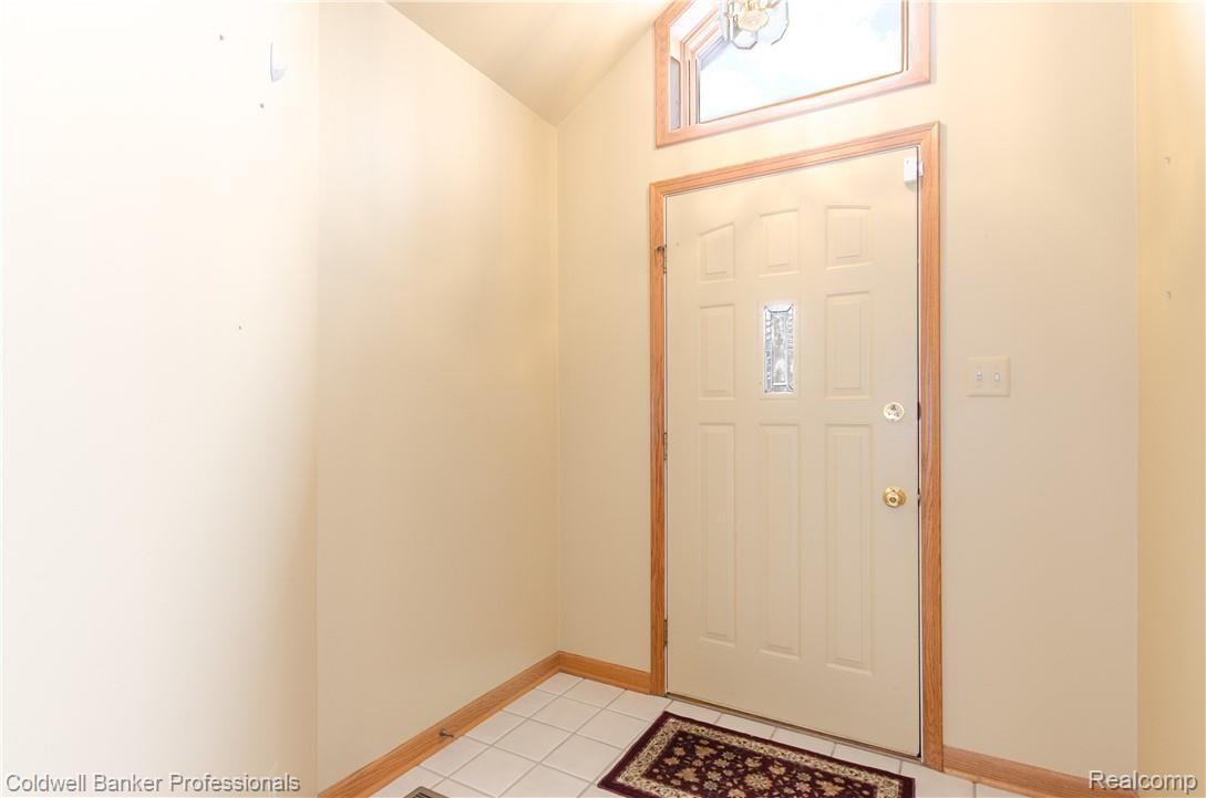 3388 Rivers Edge Drive, Unit 2 Wayne, MI 48184 - Photo 5 of 42 Foyer has ceramic flooring and transom window