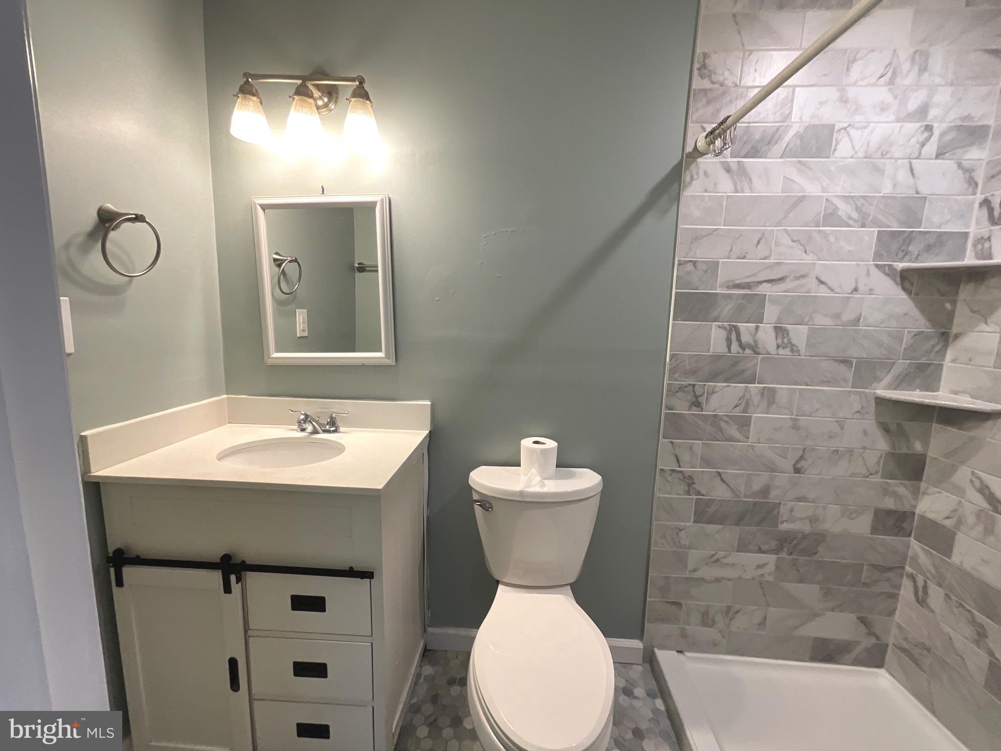 86 Kelley Road Fredericksburg, VA 22405 - Photo 20 of 36 a bathroom with a toilet sink and mirror