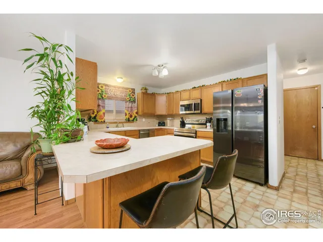 a kitchen with a table and chairs