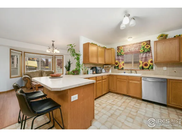 a kitchen with a sink cabinets and window